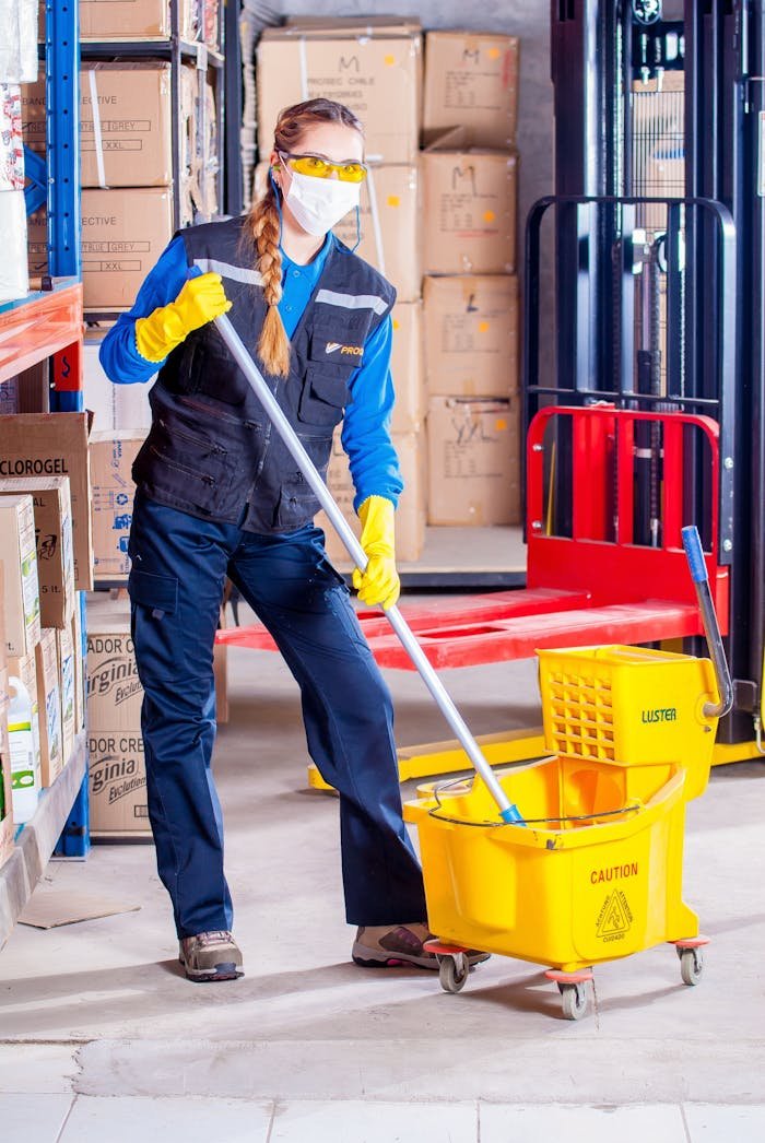 Woman Holding Mop